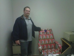 Greg with wrapped chair 300x225 Look what I got for Christmas